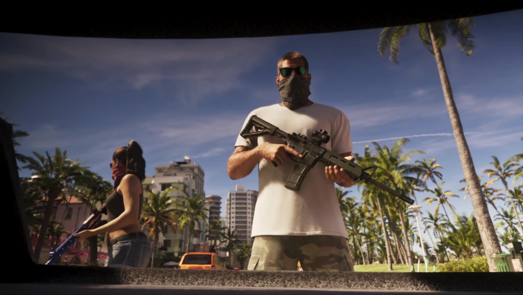 Masked Jason with a rifle and Lucia armed behind him above a Vice City boulevard